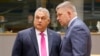 Hungarian Prime Minister Viktor Orban (left) speaks with his Slovakian counterpart Robert Fico prior to the start of a EU leaders summit in Brussels. (file photo)