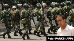 Chinese riot police patrol a street in Urumqi in China's Xinjiang Province. (file photo)