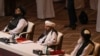 Members of the Taliban delegation attend the opening session of peace talks between the Afghan government and the Taliban in the Qatari capital, Doha, on September 12.