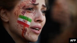 A demonstrator attends a rally in support of the Iranian protests in Paris on October 9.