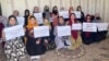 Afghan women protest inside a home in Kabul on August 15.