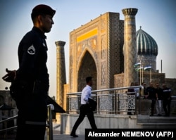 A police officer guards Registan Square in downtown Samarkand as the SCO summit is under way.