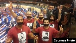 Azerbaijani activists protests against Azerbaijani President Ilham Aliyev's speech at the Council of Europe's Parliamentary Assembly in Strasbourg on June 24.