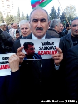 A protester urges the release of activist Yadigar Sadiqov, who is serving a six-year prison sentence.