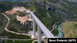 An aerial views shows a part of the new highway connecting the city of Bar on Montenegro's Adriatic coast to landlocked neighbor Serbia near Matesevo in May 2021.