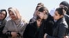 Mourners react during the funeral of Kurdish medical student Shinda Kisho, who was killed in Latakia, March 9