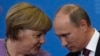 Germany's Chancellor Angela Merkel (left) and Russia's President Vladimir Putin attend a news conference after their meeting at the St. Petersburg International Economic Forum in June 2013.