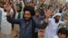 Supporters of the hard-line Tehrik-e Labaik Pakistan chant slogans as they block a street during a protest after their leader was detained following his calls for the expulsion of the French ambassador, in Lahore on April 16.