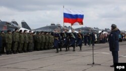 Participants attend a ceremony to welcome Russian military jets and pilots upon their return to a domestic airbase on March 15, not long after President Vladimir Putin announced that they had "generally accomplished" their objectives in Syria.