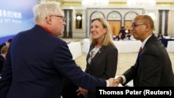 Russian Deputy Foreign Minister Sergei Ryabkov (left) greets U.S. Undersecretary of State Andrea Thompson (center) and U.S. envoy to the Conference on Disarmament Robert Wood in Beijing on January 30.