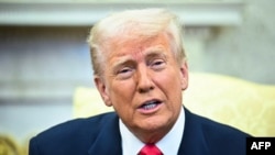 US President Donald Trump speaks to reporters at the White House in Washington, D.C. March 12. 