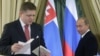 Vladimir Putin (right) looks on as Slovak Prime Minister Robert Fico addresses a joint news conference after a meeting in Moscow in 2009.