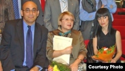 Arif (left to right), Leyla, and Dinara Yunus attend an award ceremony (file photo)