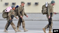 U.S. soldiers before boarding a plane on their way home from Afghanistan at the U.S. transit center at Manas in March.