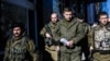 Separatist gunmen guard Aleksander Zakharchenko (center), prime minister of the self-proclaimed Donetsk People's Republic in Donetsk.