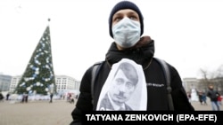 A protester attends a rally against the deepening of Belarus-Russia integration in Minsk in December 2019.