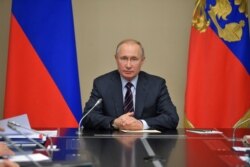 "The decider": Russian President Vladimir Putin chairs a Security Council meeting at the Novo-Ogaryovo residence outside Moscow on February 21.