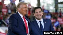 U.S. President Donald Trump (left) and Secretary of State Marco Rubio 