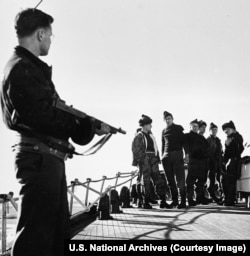 A group of German prisoners captured by a US Coastguard vessel in WWII.