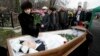 Nataliya Magnitskaya, mother of Sergei Magnitsky, grieves over her son's body during his funeral at a cemetery in Moscow in this photo from November 20, 2009.