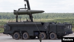 Russian servicemen equip an Iskander tactical missile system at the Army-2015 international military-technical forum in Kubinka, outside Moscow, in 2015.