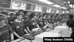 A phalanx of young, crisp-uniformed employees at the counter of Russia's first McDonald's restaurant on Pushkin Square in 1990. 