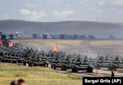 Chinese tanks roll about 250 kilometers southeast of the Russian city of Chita during the Vostok 2018 military exercises in September 2018.