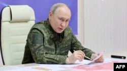 When visiting troops in Kursk, Putin wore military garb.