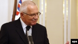 Czech President Vaclav Klaus speaks with reporters just after he signed the Lisbon Treaty in Prague.