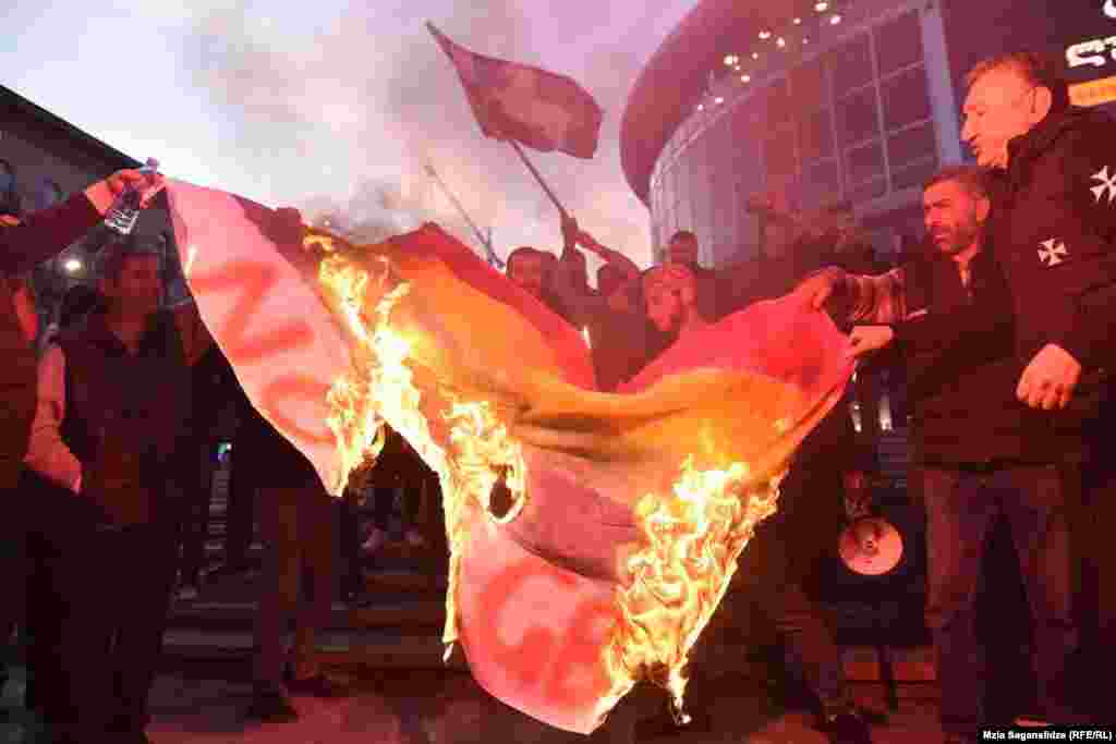 Demonstrators burn an LGBT flag before the screening in Tbilisi.&nbsp;