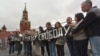 Human rights activist Natalya Gorbanevskaya (4th from left) attends a memorial protest action on Red Square in Moscow on August 25, 2013, with the banner "For your freedom and ours."