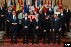 European and Canadian leaders pose for a group photograph with Ukrainian President Volodymyr Zelenskyy (front row, second from right) at the Lancaster House summit in London on March 2.