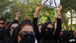 Iranian women protest recent acid attacks in front of the judiciary building in Isfahan.