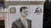 A bullet-riddled portrait of Bashar al-Assad in the city of Hama