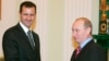 Russian President Vladimir Putin's reported buildup in Syria may be a move to maintain a foothold in that country -- and try to secure a strong say in what comes next -- in the event that President Bashar al-Assad (seen here with Putin in 2006) is ousted.