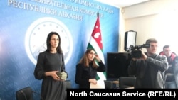 Abkhazia election officials talk to reporters during the run-up for the upcoming vote to select a de facto president in the separatist territory. 