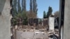 A burned down house in the village of Maksat in the Leilek region on May 2.