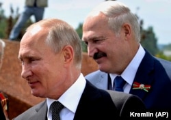 Vladimir Putin (left) and Alyaksandr Lukashenka -- heading in the same direction?