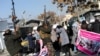 Taliban fighters fire shots in the air to disperse women protesters in Kabul.