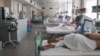 Patients lie in bed at a Moscow Hospital treating people suffering from COVID-19 on June 23.