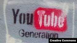 "YouTube generation" ("YouTube буыны" атты граффити). Көрнекі сурет